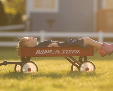 little boy sleeping outside