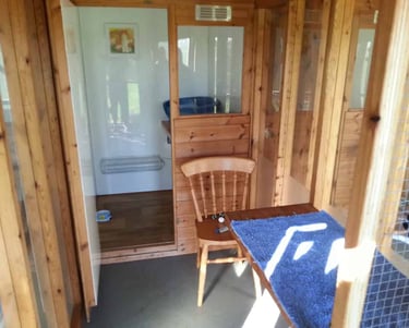 Looking into a chalet, showing the run and sleeping area