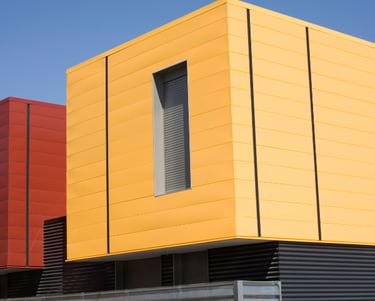 a building with a yellow and red building with a red and yellow building in the