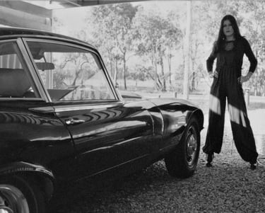Lauren Hart strikes a pose with Peter Pickering's Jaguar E-Type V12