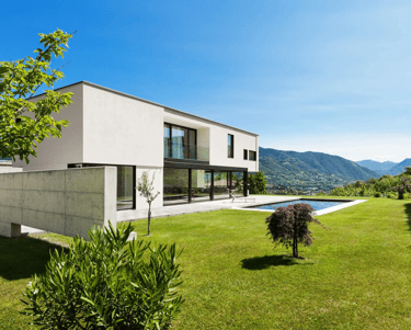 a house with a pool and a pool in the background