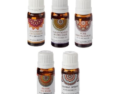 a group of five bottles of essential oils