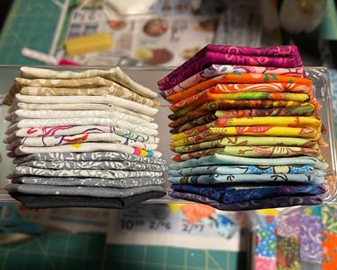 a bunch of sewn cloth hexagons stacked on top of each other