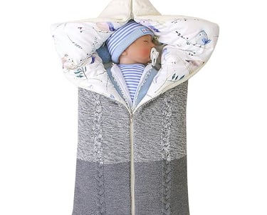 Knitted shell baby sleeping bag with cotton liner. Zipper access to open and convert to a baby blanket.