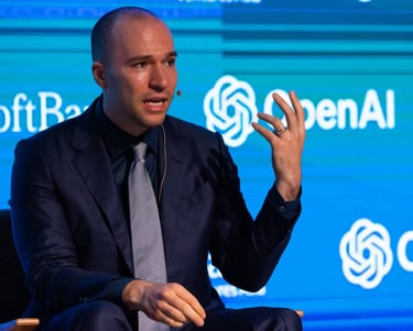 a man in a suit and tie is sitting in a chair