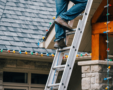 installing christmas lights on a ladder