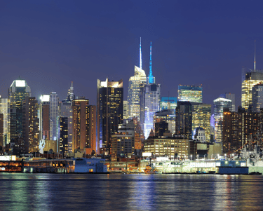 a city skyline with a boat in the water