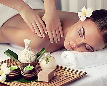 a woman getting a massage at a spa