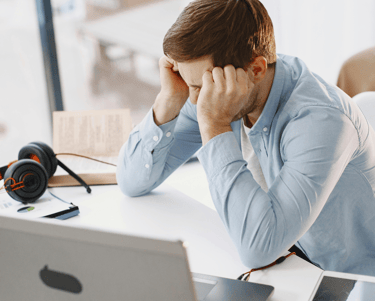 man at computer frustrated