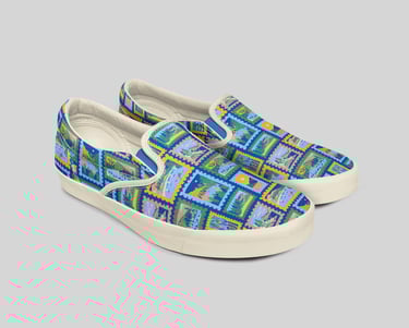 a pair of shoes with a colorful pattern of mountains on the top
