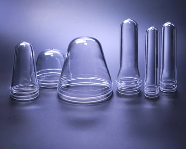 a group of clear glass vases with clear glass
