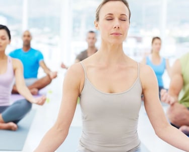 a woman sitting in a yoga pose