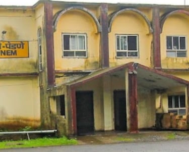 a pernem train station building with a sign that says, the name of the building is a pernem