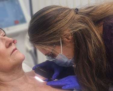 Dr. Sara Hashemzadeh is conducting a patient examination at Ariana Esthetic Edmonton