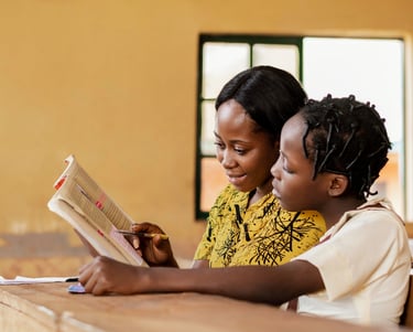 A teacher helping a child in class