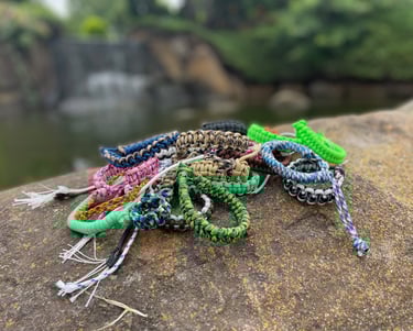 A scene with paracord products on a rock