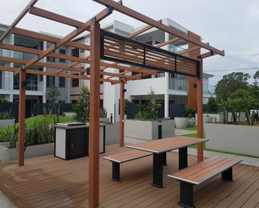 Wood grained aluminium pergola over a composite deck