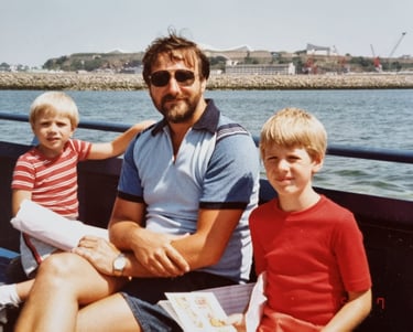 photo of my brother, Dad and me on a boat on a beautiful sunny day