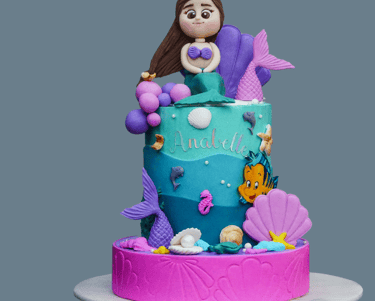 a cake with a mermaid tail tail tail and a mermaid tail