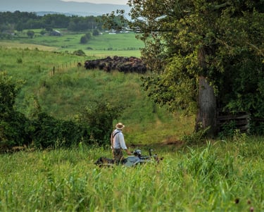 a rancher in a hat and a hat on Lick Skillet farm