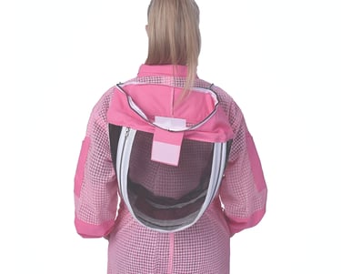 a woman in a pink beekeeping suit and a pink suits