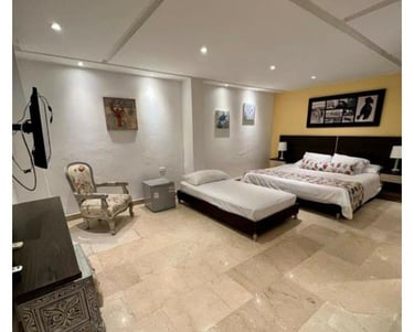 a bedroom with a bed and a couch