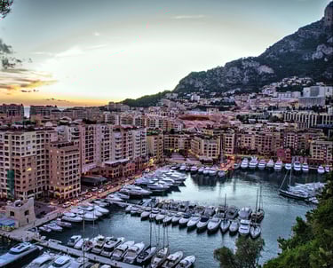 boats in Port of Cannes with buildings at sunset