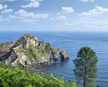 Coast off of Bilbao Spain with house on rocks