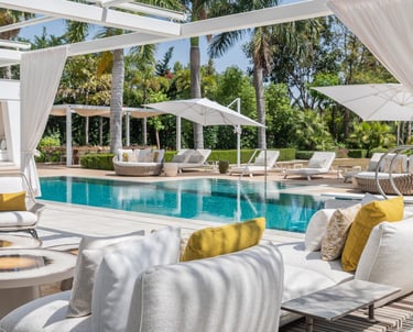 Pool area at Villa Serenity featuring modern furnishings, sunbathing lounges, and chill-out areas