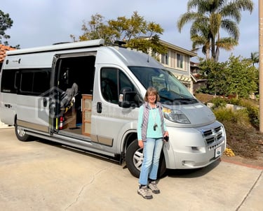 Lady standing in front of her Ram Travato 2017