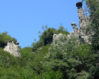 Earth Pyramids of Zone, tall stone spires capped with boulders near Lake Iseo
