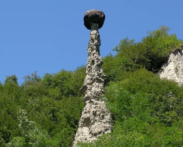 Earth Pyramids of Zone, tall stone spires capped with boulders near Lake Iseo