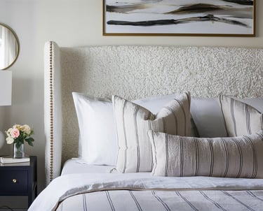 a bed with a white bed and a lamp
