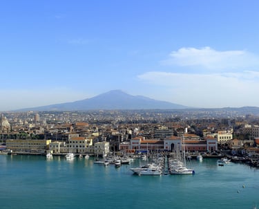 Cantania harbor with Mt. Etna in distance