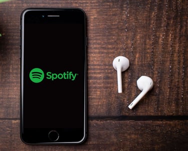 a phone next to pair of earphones
