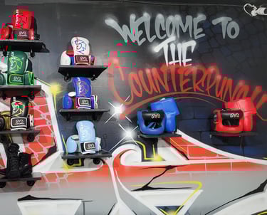 a wall displaying multiple boxing gloves and graffiti