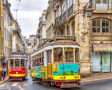 Tram running through the streets of Lisbon Portugal