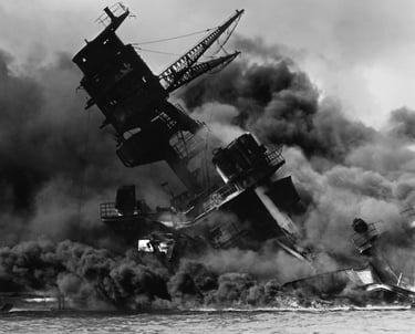 A torpedoed World War II battle ship sinking, representing events in the era of the story.