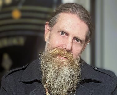a bearded man posing