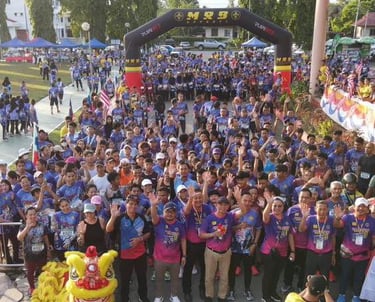 A group photo of LIONS Tuaran Fun Run & Ride wearing race packs, jersey, and medal by MRB Apparel