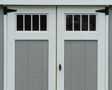 Custom shed door with transom window built in Halifax, Massachusetts showcasing craftsmanship and design.