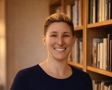 a woman in a blue dress standing in front of a bookcase