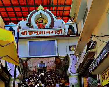 a person holding a bunch of flowers in front of a building