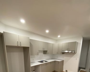 a kitchen with a wooden floor and a sink