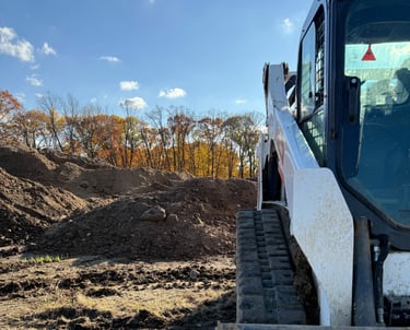 skid-steer-with-dirt-pile