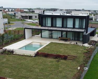 a house with a pool and a pool in the yard