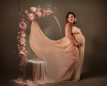 a pregnant woman in a dress with a veil