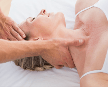 woman having sports massage neck back pain DD8