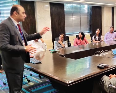 Dr. Prabal Frank Nandwani conducting corporate leadership training workshop in a large boardroom