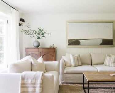 a living room with a couch and a table